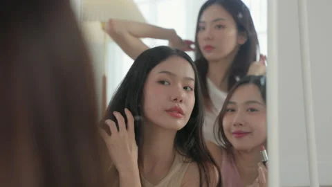 Asian Women Looking In The Mirror To App Stock Video Pond