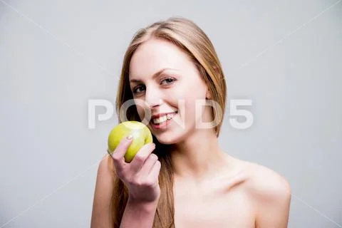 Photograph Beautiful Naked Woman With The Apple Light Background