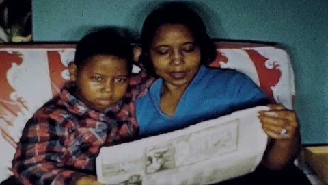 Black Mother And Son Read Local Newspape Stock Video Pond