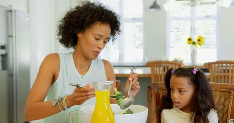 Black Mother Serving Food To Her Daughte Stock Video Pond5