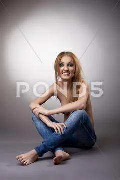 Half Nude Woman Sit In Jeans Premium Stock Photo