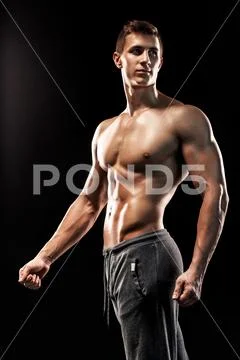 Image Of Very Muscular Man Posing With Naked Torso Stock Photo