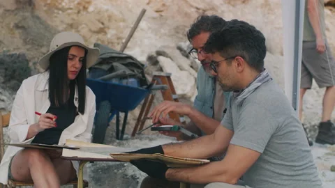 Male And Female Archaeologists Examining Stock Video Pond5