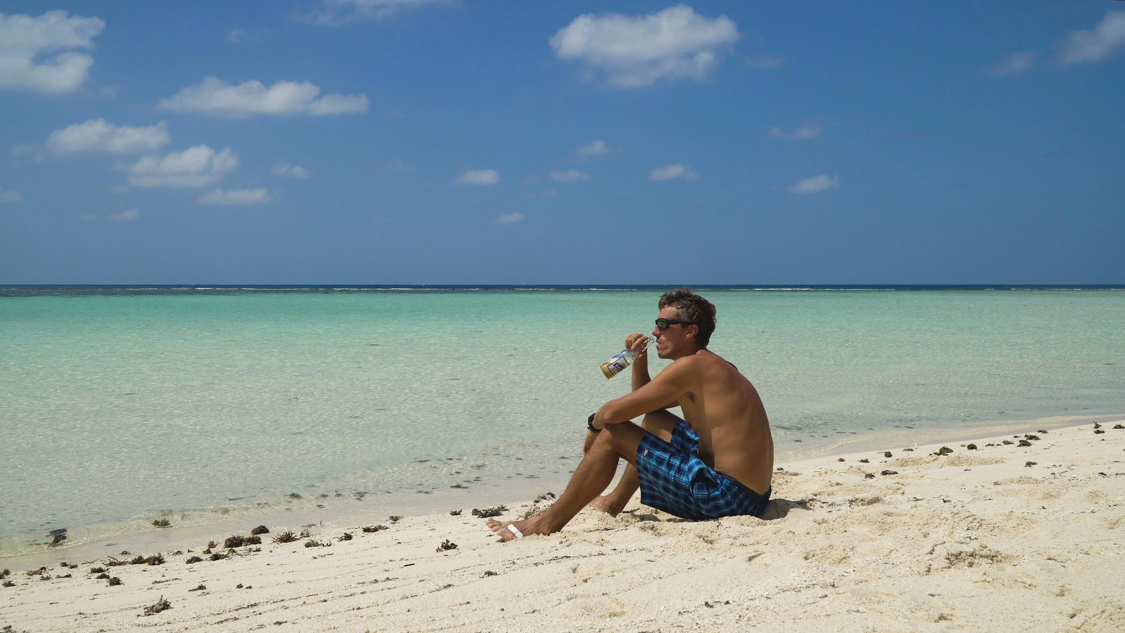 man-drinking-beer-beach-footage-072300144_prevstill.jpeg