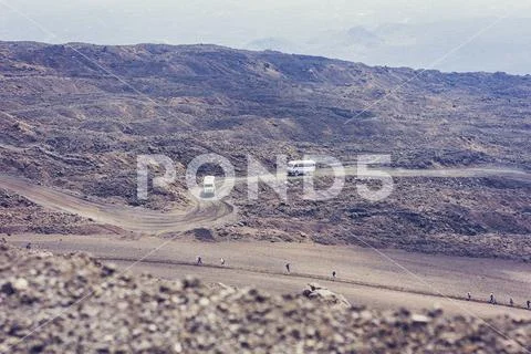 People Walking On Mount Etna Active Volcano On The East Coast Of