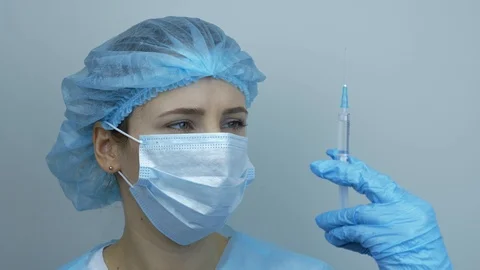 Portrait Of Female Nurse Holding Syringe Stock Video Pond