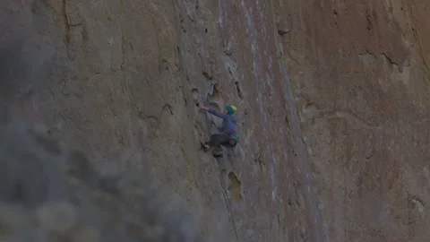 Rock Climber Makes Her Way Up Rock Cliff Stock Video Pond