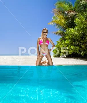 Sexy Woman In Bikini Near The Pool At Maldives Tropical Island Elegant