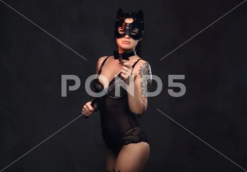 Sexy Woman Wearing Black Lingerie In Bdsm Cat Leather Mask And