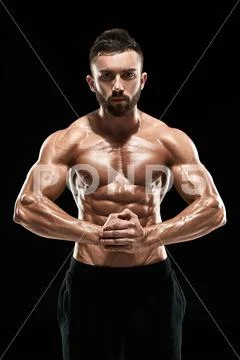 Very Muscular Man Posing With Naked Torso In Studio Premium Photo