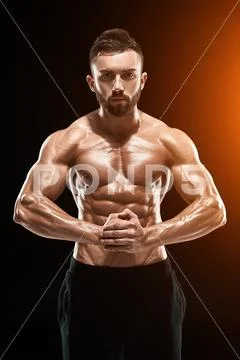 Very Muscular Man Posing With Naked Torso In Studio Hi Res