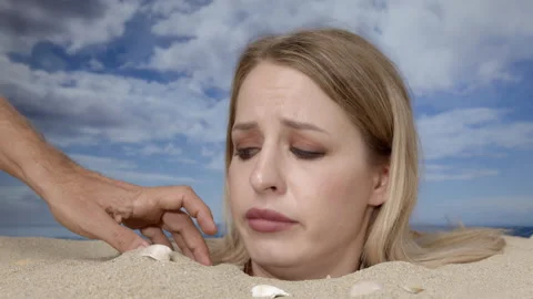 Woman Buried In Sand On Beach With A Han Stock Video Pond