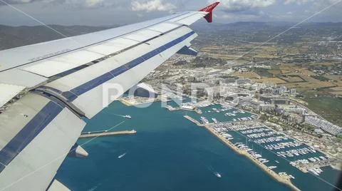 Air Berlin Airplane approaching tourist center on Ibiza