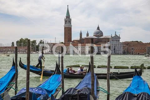 Gondolas in Venice with Isola San Giorgio, Italy