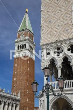 Detail of the facade of Doge's Palace and Campanile on St. Mark's Square in Venice, Italy