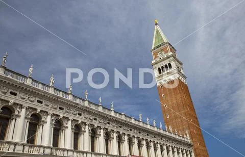 Detail of the facade of the Biblioteca Marciana and Campanile on St. Mark's Square in Venice, Italy