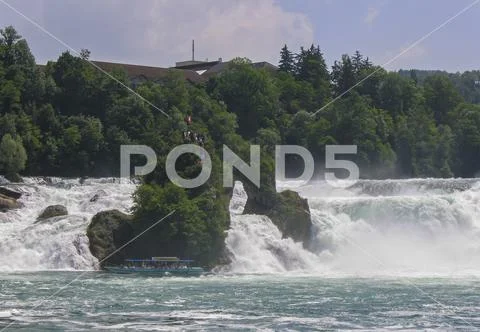 Rhine Falls with viewing rocks and boat