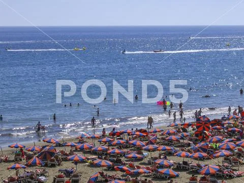 Tourists crowded beach in Gran Canaria