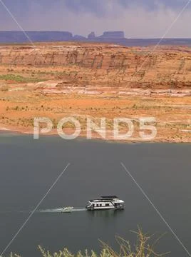 Lake Powell Reservoir in Arizona, USA with houseboat