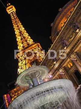 Hotel Paris with Eiffel Tower and fountain at night