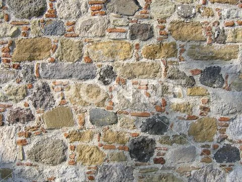 Brick wall made of natural stone in Greece