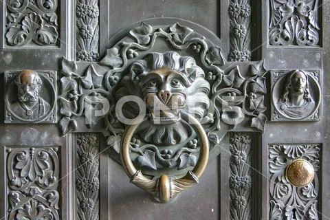 Old lion door knocker made of brass