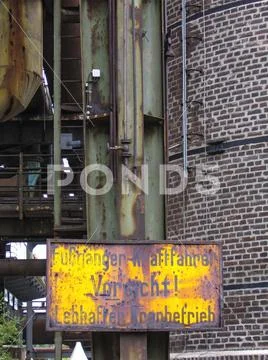 German warning sign in industrial plant