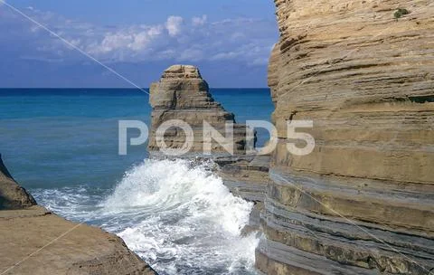 Sandstone coast with surf on Corfu, Greece