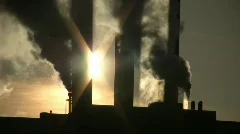 Fumes billow from giant chimney amidt the sunlight (High Definition)