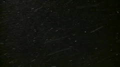 Brightly lit snow drifts against the night sky (High Definition)