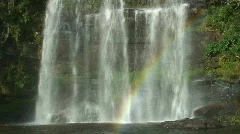 Tropical waterfall with rainbow
