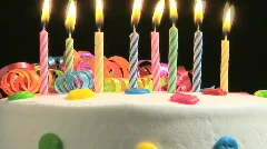 Birthday candles on cake, time lapse