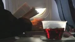 Soda in cup moves with turbulents aboard plane