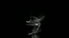 White smoke on black background loop