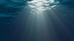 Underwater Scene With Sunrays Shining Through The Water's Surface