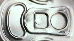 Top of soda can being opened, vertical