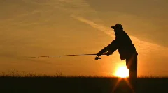 fisherman throws fishing tackles