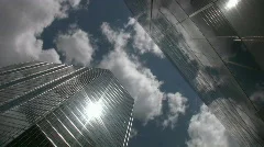 Timelapse towers. Sun and cloud reflections.