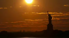 Time lapse - Sunset behind Statue of Liberty