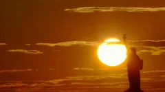 Time lapse - Sunset behind Statue of Liberty