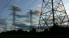 Electrical pylons at sunset. Timelapse.