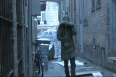 Homeless Drunk Bum Walks Down a Cold Wet Alley 