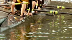 Crew Team Sit in Boat on Water