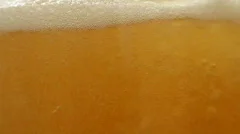 Beer is poured in a glass.