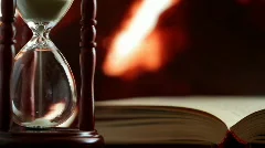 hourglass and book