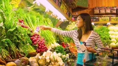 Young Asian Woman Shopping for Vegetables