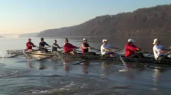 Crew boat rows with the Hudson highlands behind them