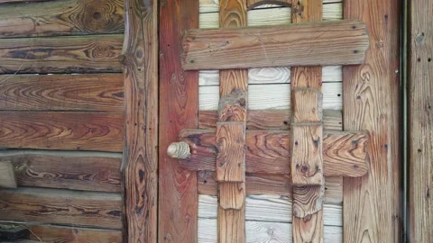 001 Falling snow on the background of a wooden door Video stock 147351553