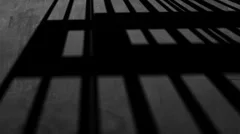 prison bars shadow floor prisoner