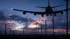 Huge jumbo jet silhouette overhead landing on runway (with audio)